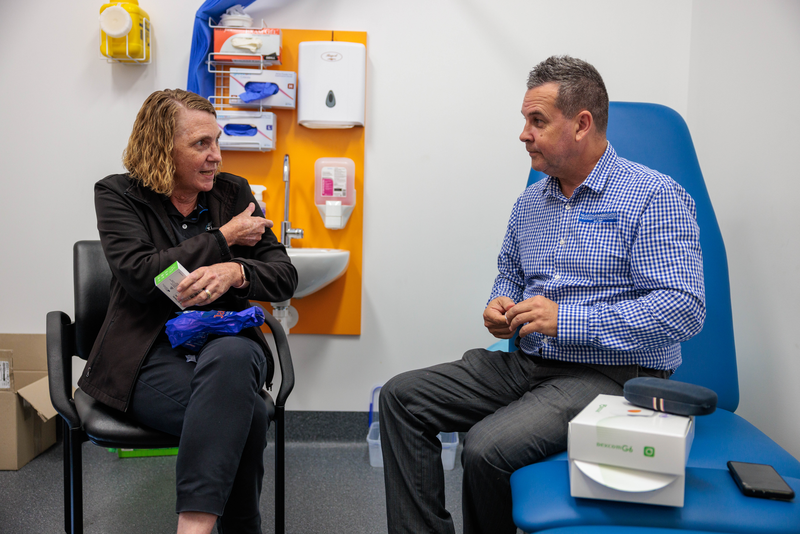 A diabetes educator sitting with an Indigenous client in the clinic, having a yarn about diabetes education for Mob.