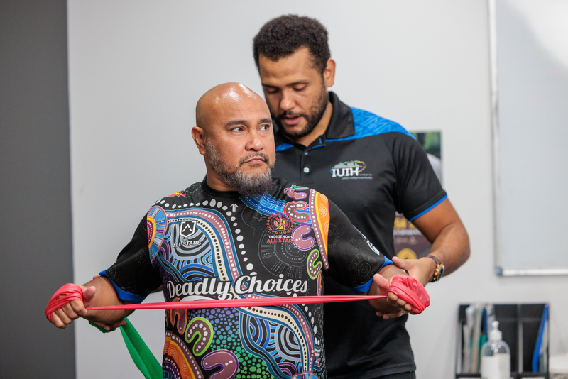 A physiotherapist with an Indigenous client